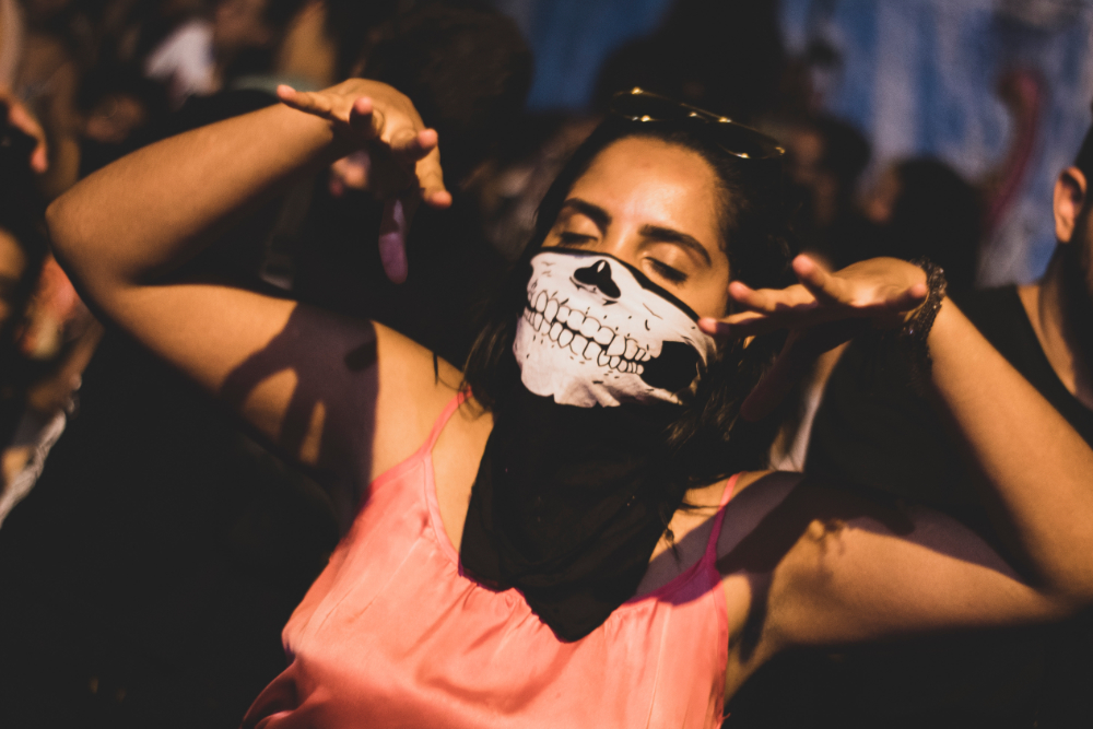 People watching a concert. Photo with a purple hue